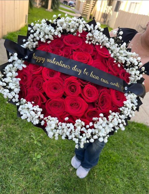 Large red rose bouquet with baby's breath and black ribbon for Valentine's Day